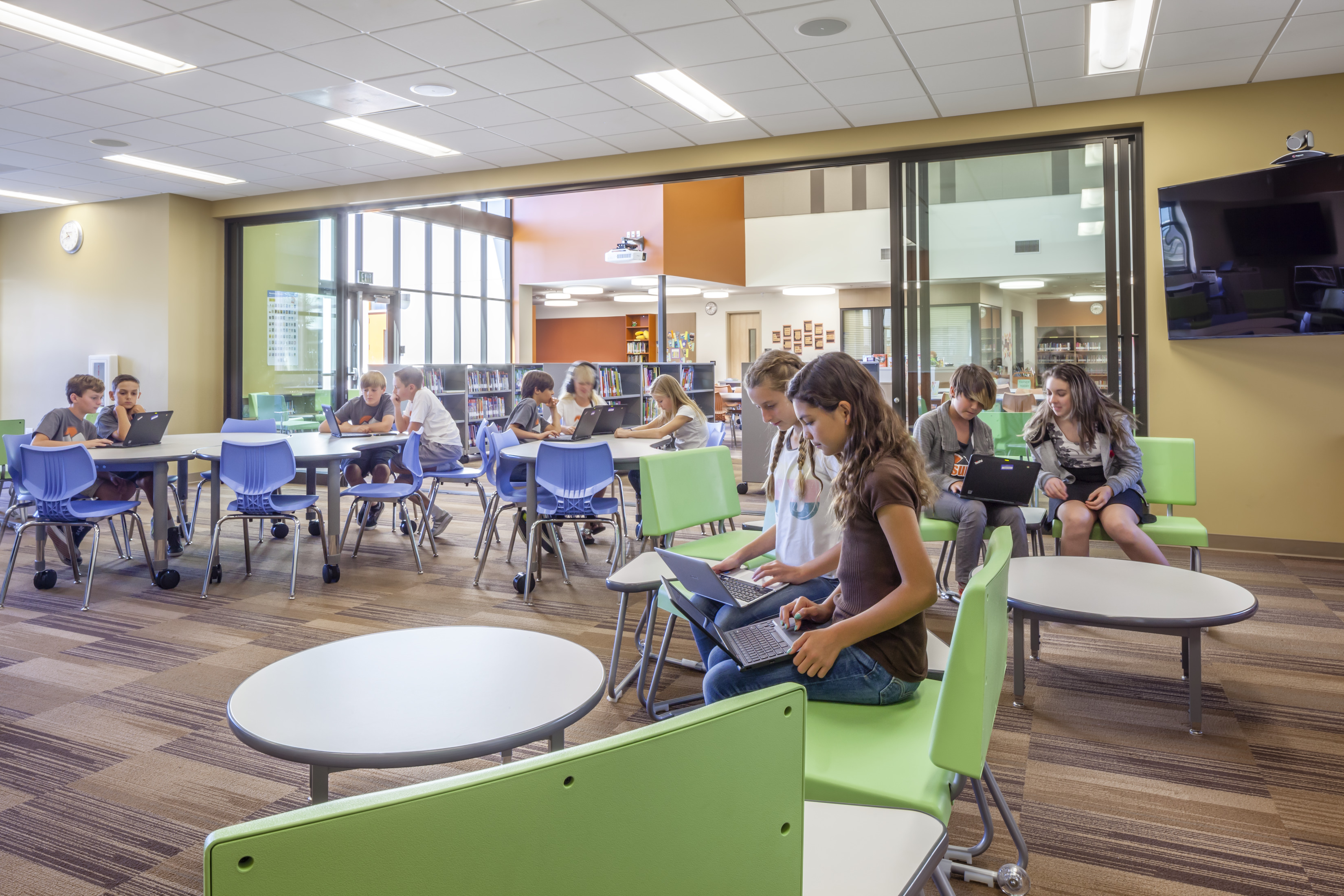 Creative concepts of interior design: sliding glass doors to open or close off education spaces can combine with classroom furniture innovations for a flexible space